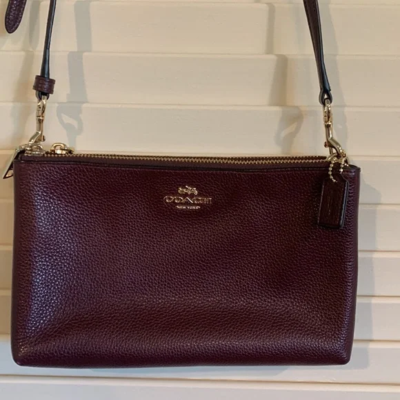 COACH crossbody purse. Leather mahogany/brown. 2 pocket adjustable strap. - Picture 1 of 7